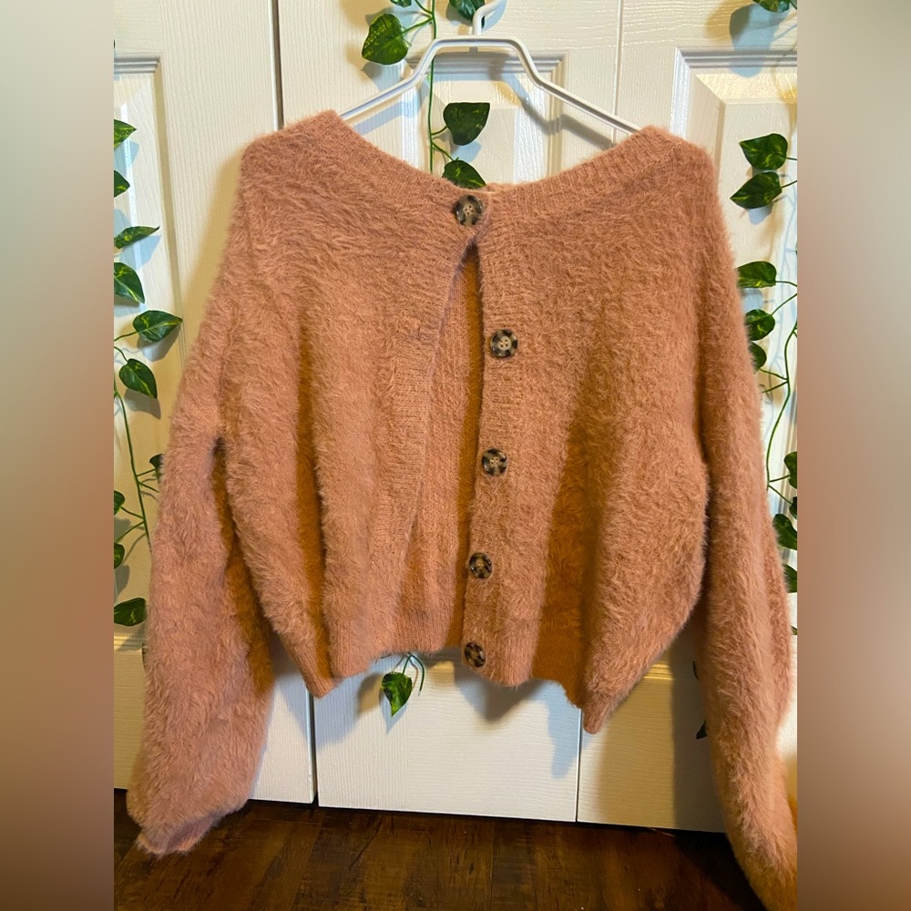 Fleece pink cardigan with brown buttons